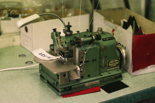 Merrow overlock machine finishing a patch edge at Northland Workwear